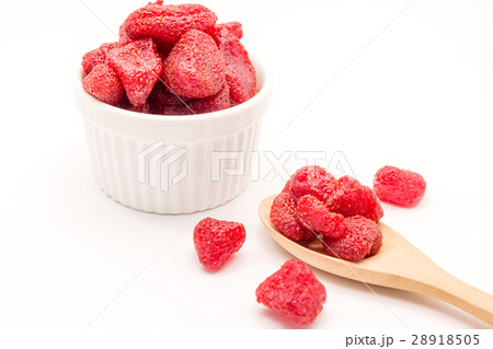 Dried strawberries in bowl on white background. 28918505