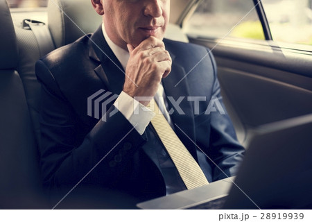 Businessman Using Laptop Car Inside Businessman Using Laptop Car Inside 28919939