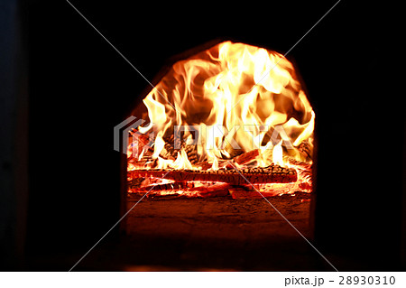 wooden logs burn with a bright flame in the fire wooden logs burn with a bright flame in the fire 28930310