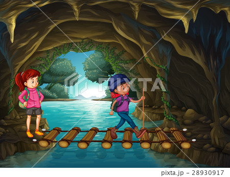 Two tourists walking in the cave Two tourists walking in the cave 28930917