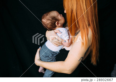 Young mother woman holding her child baby 28932667