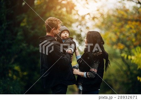 young family and newborn son in autumn park 28932671