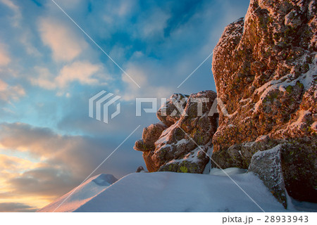 rock covered with snow and fog 28933943