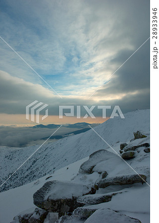 rock covered with snow and fog 28933946
