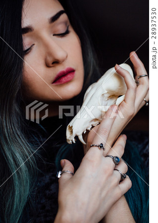 Portrait of a young girl holding a mysterious Portrait of a young girl holding a mysterious 28937530