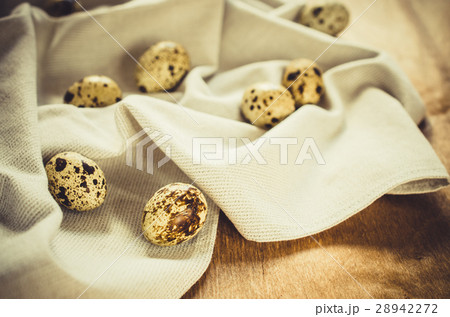 Fresh Organic Quail Eggs on Wooden Table. 28942272