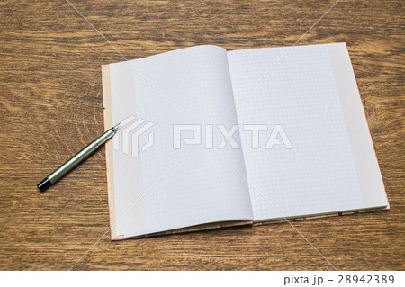 Paper and pencils on the wooden table. close-up. Paper and pencils on the wooden table. close-up. 28942389