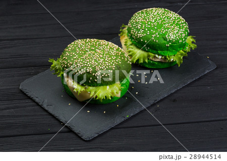 fresh green tasty burger on black background fresh green tasty burger on black background 28944514