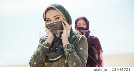 Thirsty women walking in a desert. Lost during the 28944721