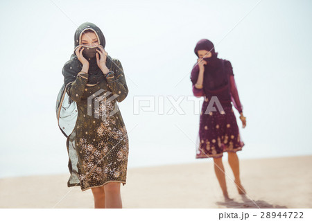 Thirsty women walking in a desert. Lost during the 28944722