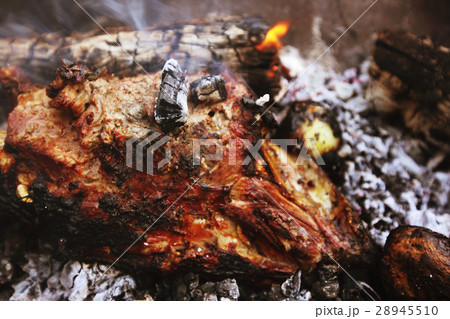 Baking lamb leg on coals 28945510