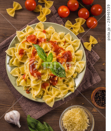 Farfalle pasta on wooden table  28946539