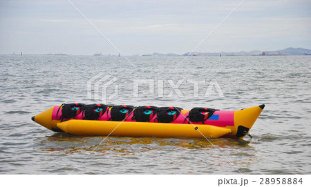 colorful banana boat floating on the sea colorful banana boat floating on the sea 28958884
