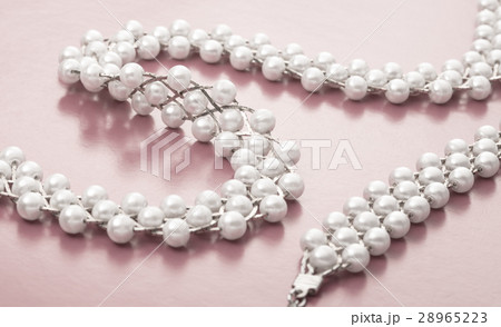 Necklace and wristband with white beads Necklace and wristband with white beads 28965223