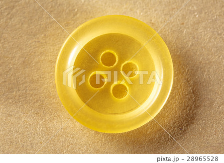 One yellow button 28965528