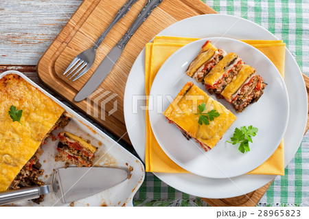 portion of layered moussaka cut into slices 28965823