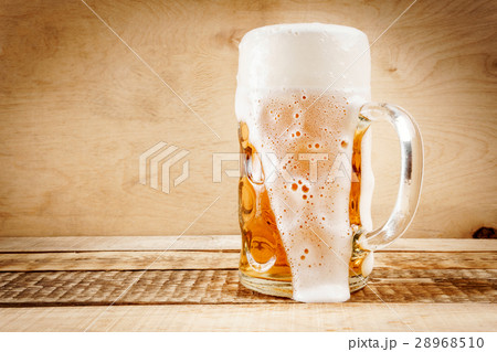 delicious beer on a wooden table 28968510