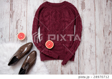 Maroon knitted sweater, brown patent leather shoes 28970712