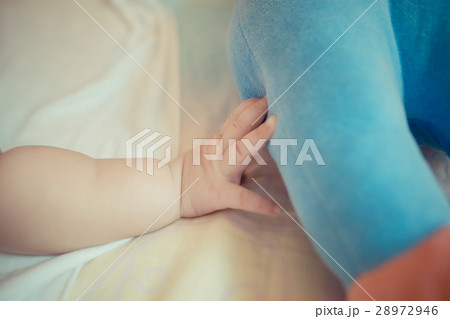 baby hand reach for doll 28972946