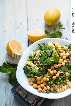 Salad with fusilli, chickpeas, grass in a white Salad with fusilli, chickpeas, grass in a white 28973468