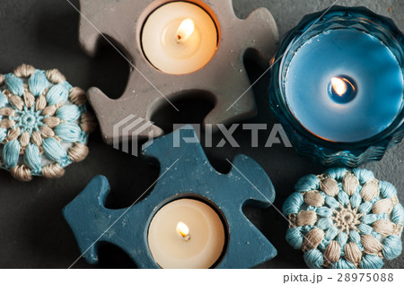 blue crochet stones and lit candles 28975088