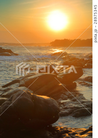tropical sea sunset on stone beach tropical sea sunset on stone beach 28975345