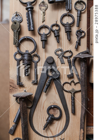 Old keys on wood wall Old keys on wood wall 28975388