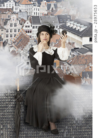 Young woman sitting on the roof 28975653