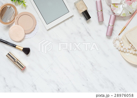 Woman's workplace with cosmetic and smartphone Woman's workplace with cosmetic and smartphone 28976058