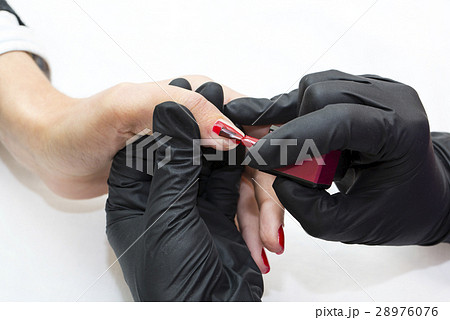 Woman hands doing manicure beauty salon close-up 28976076