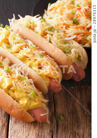 Delicious hot dog with sausage, sour cabbage Delicious hot dog with sausage, sour cabbage 28976315