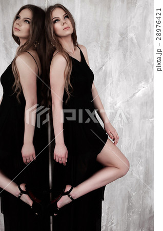 Young girl wearing black dress. Young girl wearing black dress. 28976421