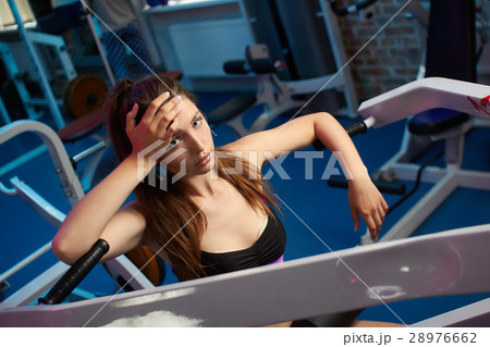 Beautiful girl take breath during fitness workout Beautiful girl take breath during fitness workout 28976662