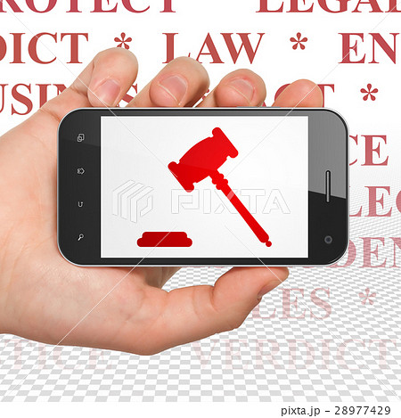 Law concept: Hand Holding Smartphone with Gavel on Law concept: Hand Holding Smartphone with Gavel on 28977429