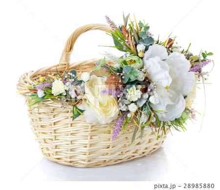 Basket decorated with flowers on white background 28985880