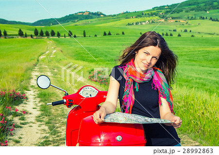 Young woman traveling by a scooter 28992863
