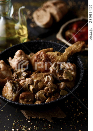 spanish grilled chicken and rabbit 28995419