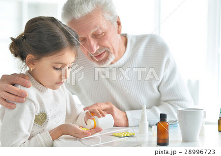 Granddaughter takes care of a sick grandfather Granddaughter takes care of a sick grandfather 28996723