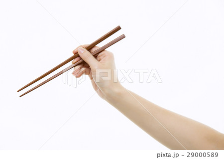 Hand holding chopsticks Close-Up Hand holding chopsticks Close-Up 29000589