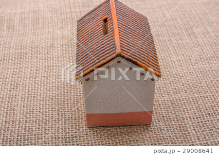 Little model house on a brown background Little model house on a brown background 29008641