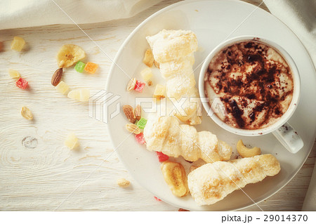 Cup of hot cocoa and cream cakes Cup of hot cocoa and cream cakes 29014370