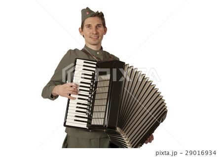 Soviet soldier playing the accordion over white 29016934