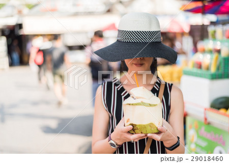 woman hold a coconut 29018460