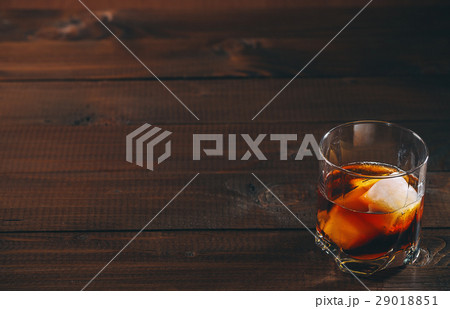 Cola with cognac or rom in glass and ice cubes Cola with cognac or rom in glass and ice cubes 29018851