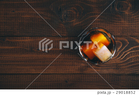 Cola with cognac or rom in glass and ice cubes Cola with cognac or rom in glass and ice cubes 29018852