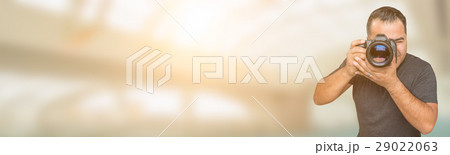 Hispanic Man with DSLR Camera Wide Banner with Room For Copy. 29022063
