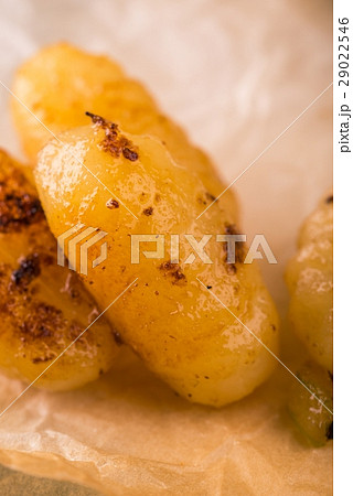 Detail of few pieces of gnocchi on paper sheet Detail of few pieces of gnocchi on paper sheet 29022546