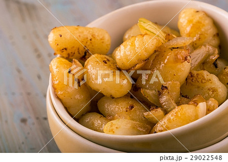 Detail of few pieces of gnocchi with onion Detail of few pieces of gnocchi with onion 29022548