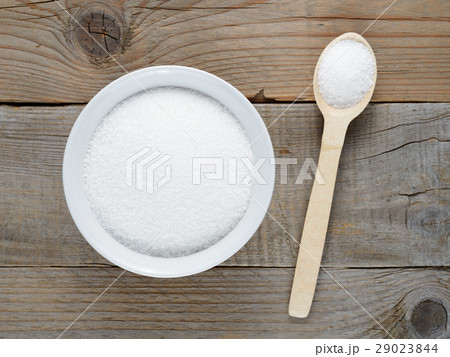 Sugar in bowl and spoon on table Sugar in bowl and spoon on table 29023844