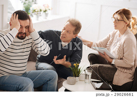 Unhappy emotional man having a quarrel with his 29026661